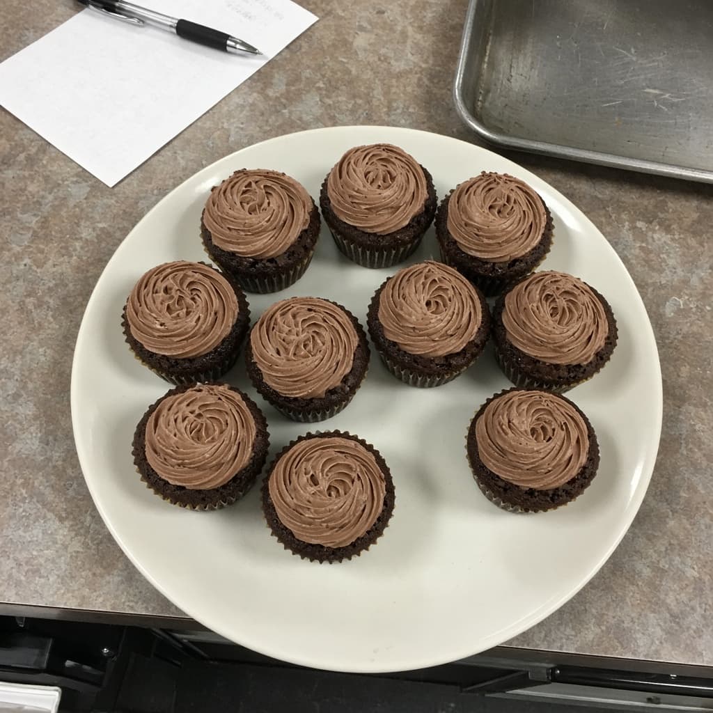 Unedited phone photo of cupcakes on a shop counter
